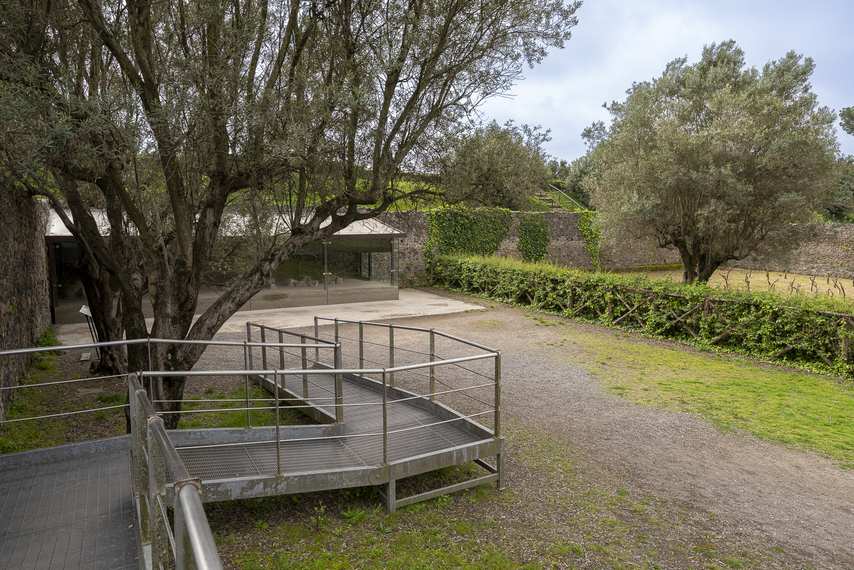 Garden of the Fugitives, victim casts display case with access via walkway