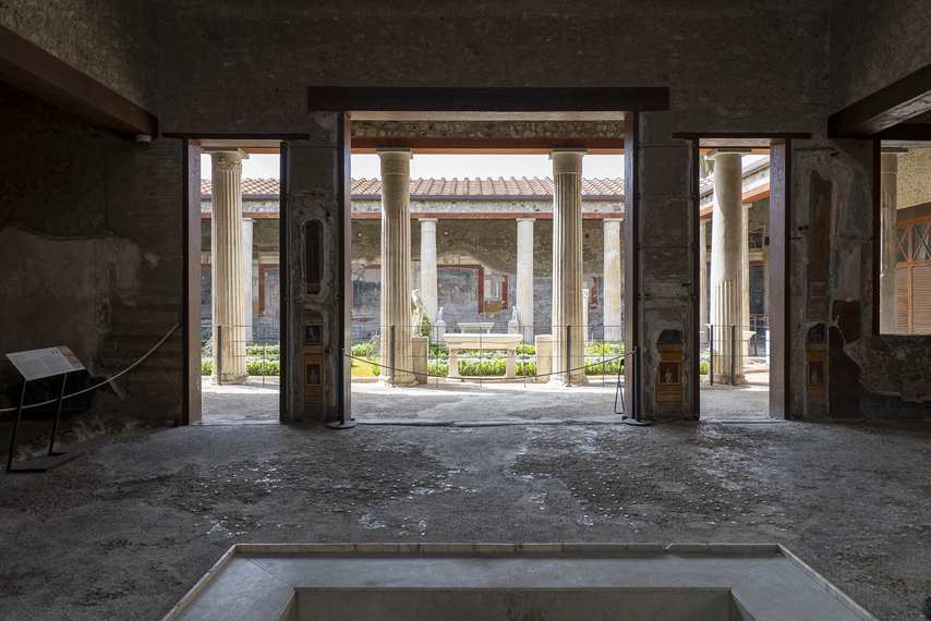 Interior of the House of the Vettii in Pompeii with a view of the atrium and central garden surrounded by columns
