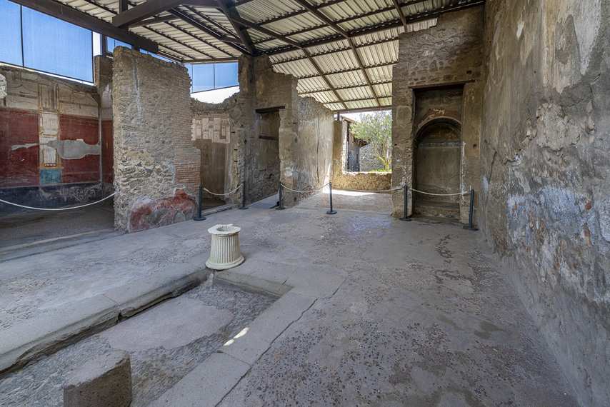 Atrium with impluvium and frescoed walls in the House of the Lararium of Achilles in Pompeii