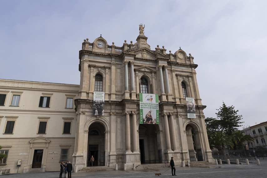 Façade of the Shrine of the Virgin of the Rosary in Pompeii with Baroque columns and statues