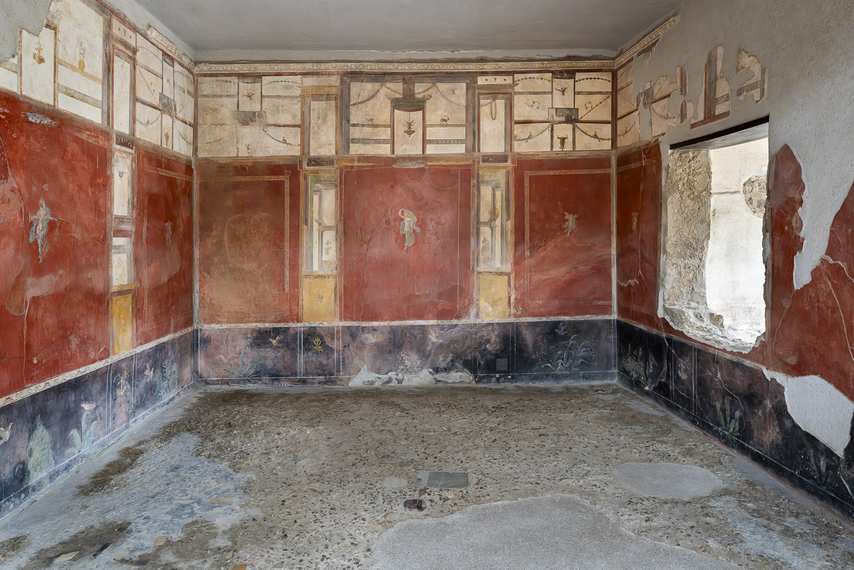 Hall frescoed with Pompeian Third Style decorations in the Fullonica of Stephanus in Pompeii