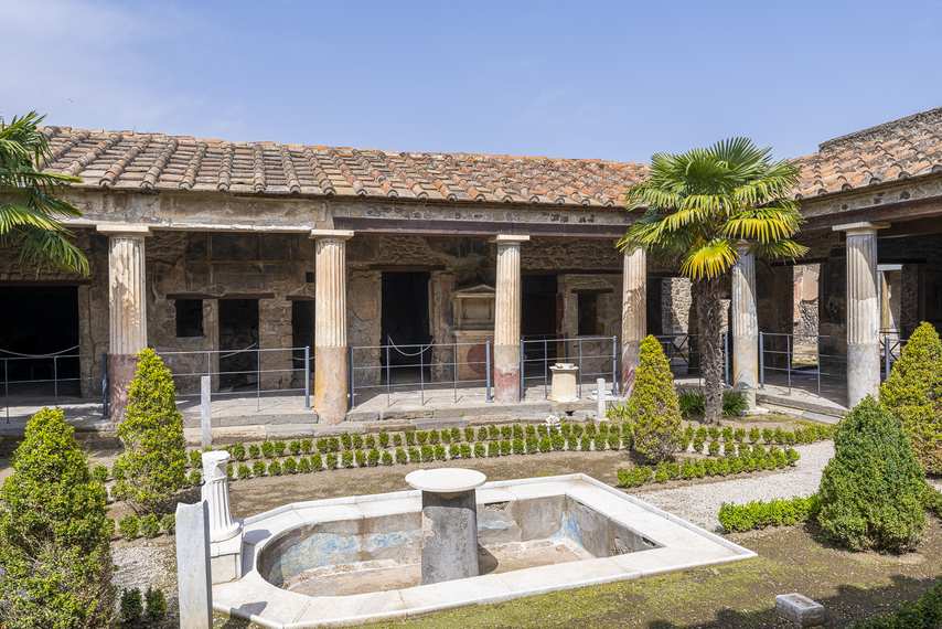 Garden with central fountain and colonnade in the House of the Gilded Cupids in Pompeii