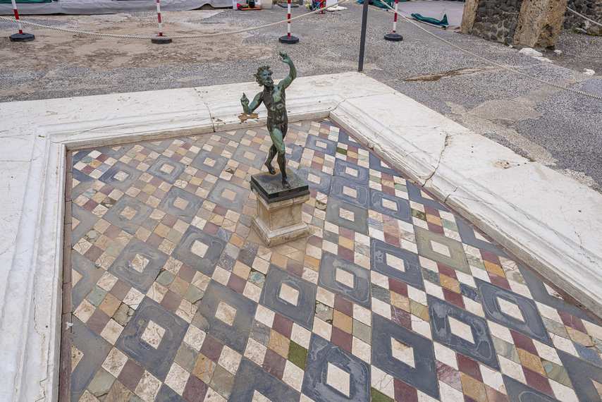 Statue of the Dancing Faun in the fountain of the House of the Faun.