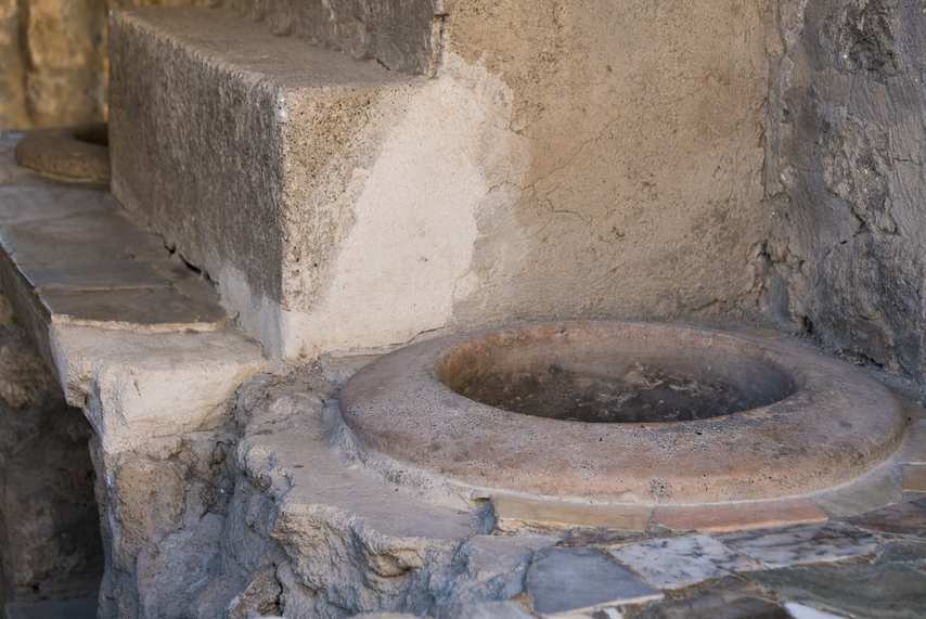 Bench with dolium in an ancient thermopolium in Pompeii