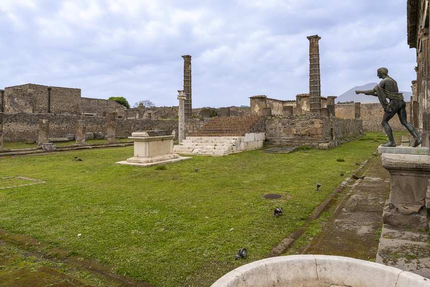 View of the Shrine of Apollo in Pompeii with columns, altar and bronze statue
