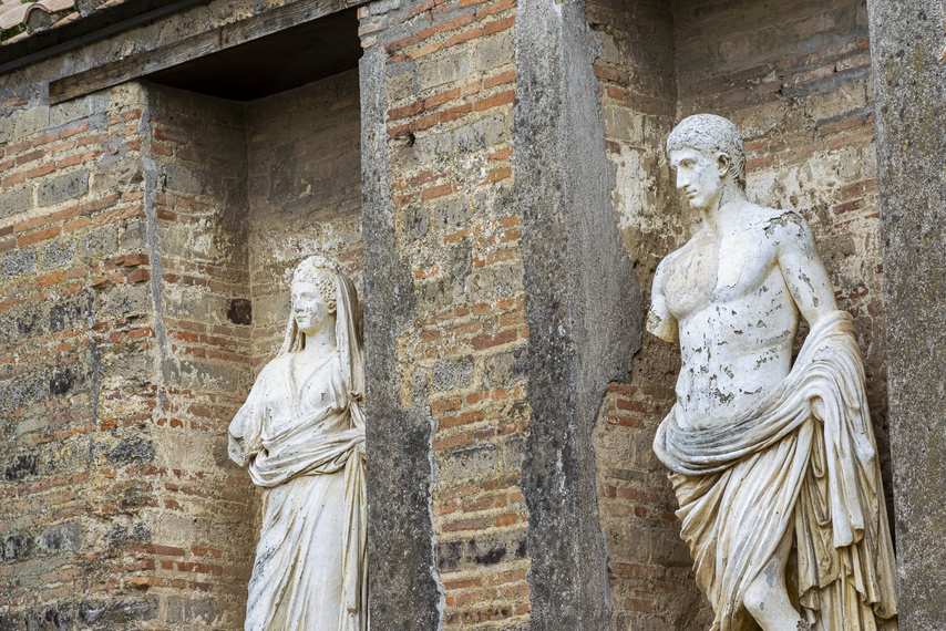 Roman marble statues inside the Macellum in Pompeii