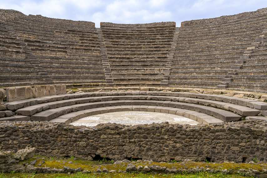 Front view of the interior of Pompeii's Small Theatre with stone bleachers