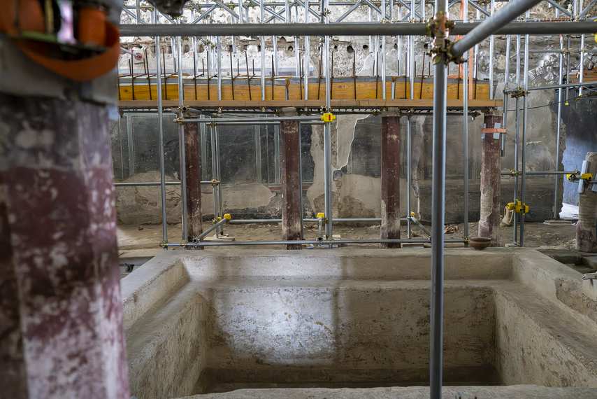 Ancient tub inside a room under restoration in Pompeii