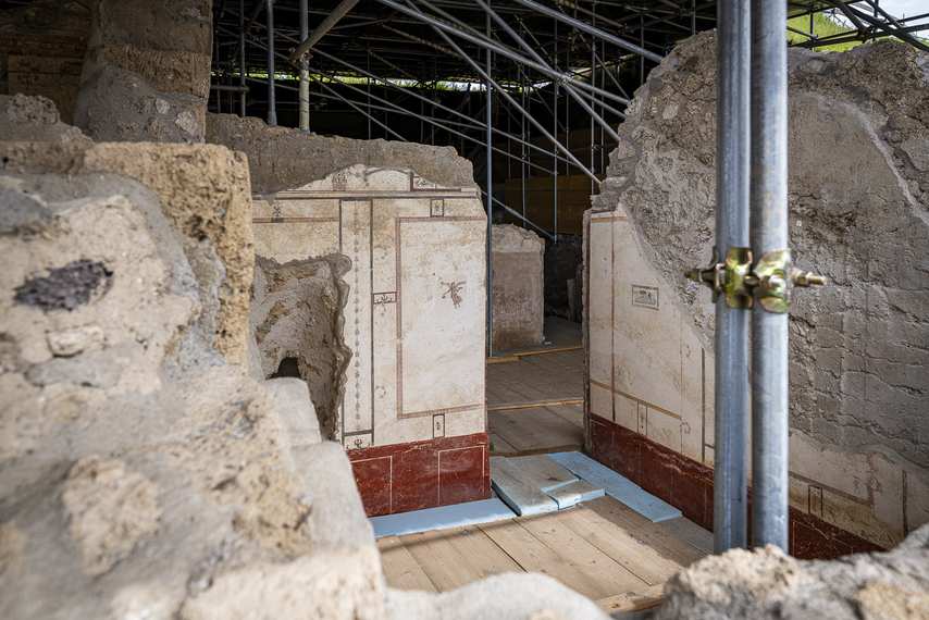 Frescoed room with geometric motifs in the House of Leda in Pompeii, during restoration.